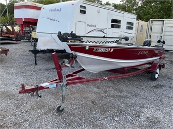 12' Lund aluminum fishing boat. - McLaughlin Auctioneers, LLC