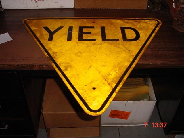 Yellow Retired Yield Sign Jerry Everitt Tractors Inc