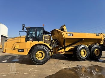 A 2019 Caterpillar 745 off-road dumper parked on a dirt lot.