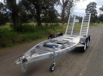 A 1900 Sureweld boat utility trailer is shown parked.