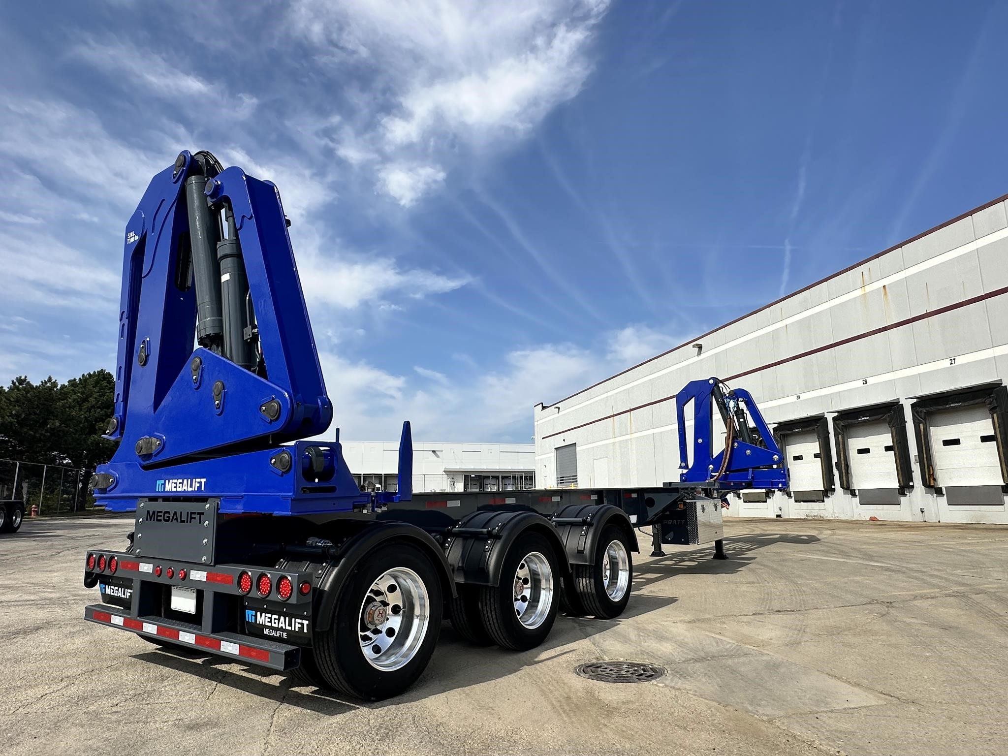 2024 Megalift SLT container lifter parked in a lot outdoors.