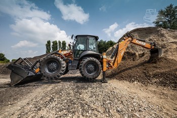 2025 Case 695SV backhoe loader shown outdoors.