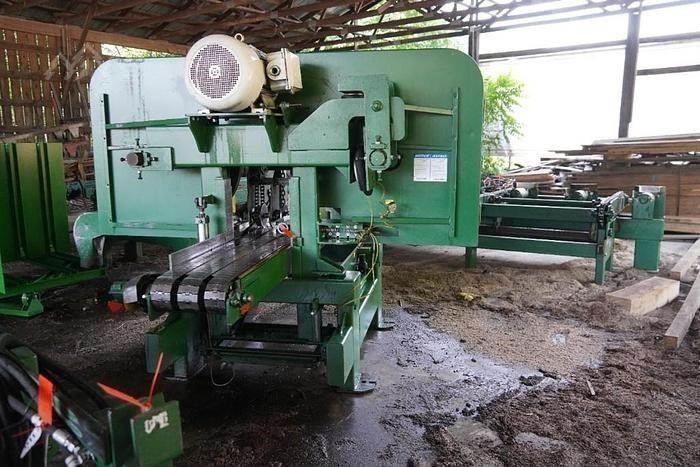 A used 2012 Brewco B1600 resaw in a shed.