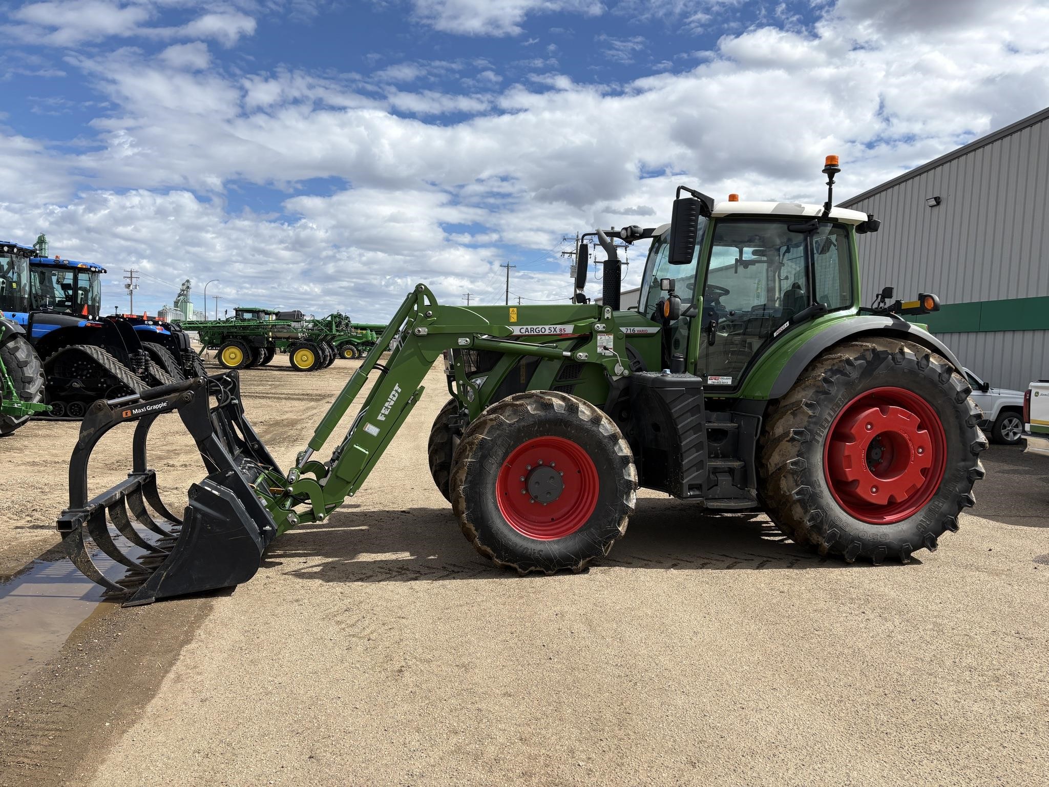 A 2021 Fendt 716 Vario tractor parked outdoors.