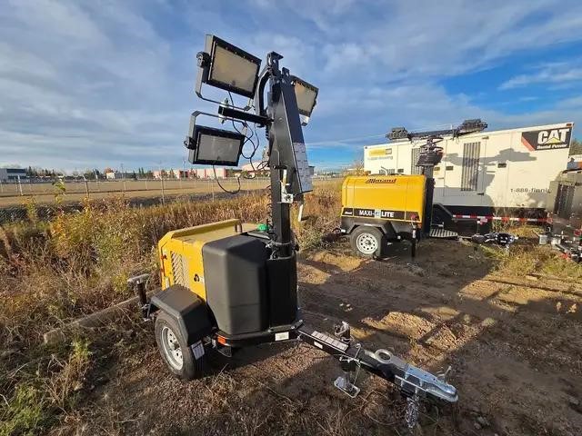 Portable 2025 Allmand Bros Night-Lite GR light tower on a dirt surface outdoors.