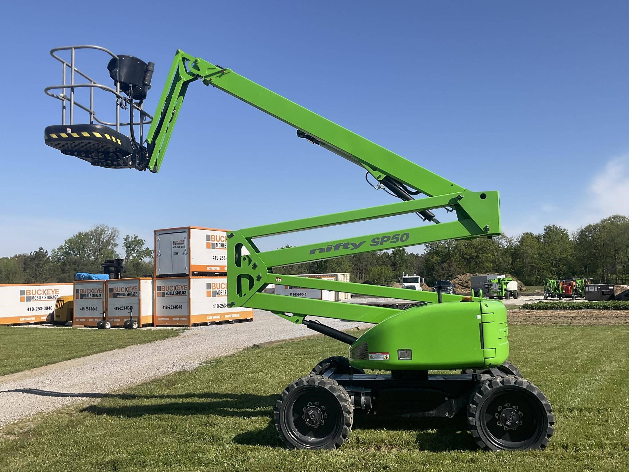A 2024 Niftylift SP50 articulating boom lift outdoors with its boom slightly raised.