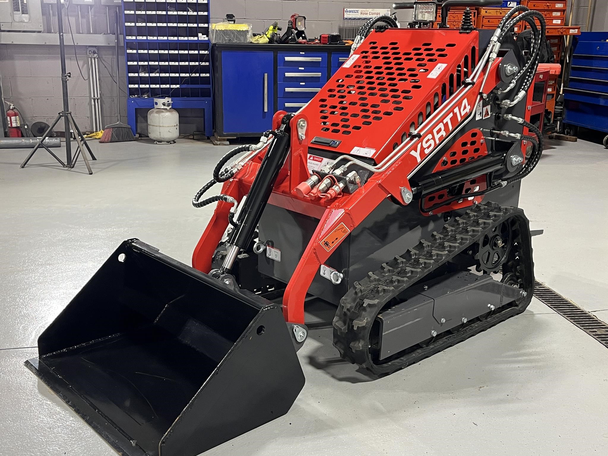 A 2026 Agrotk YSRT14 Mini Skid Steer sits in a warehouse.
