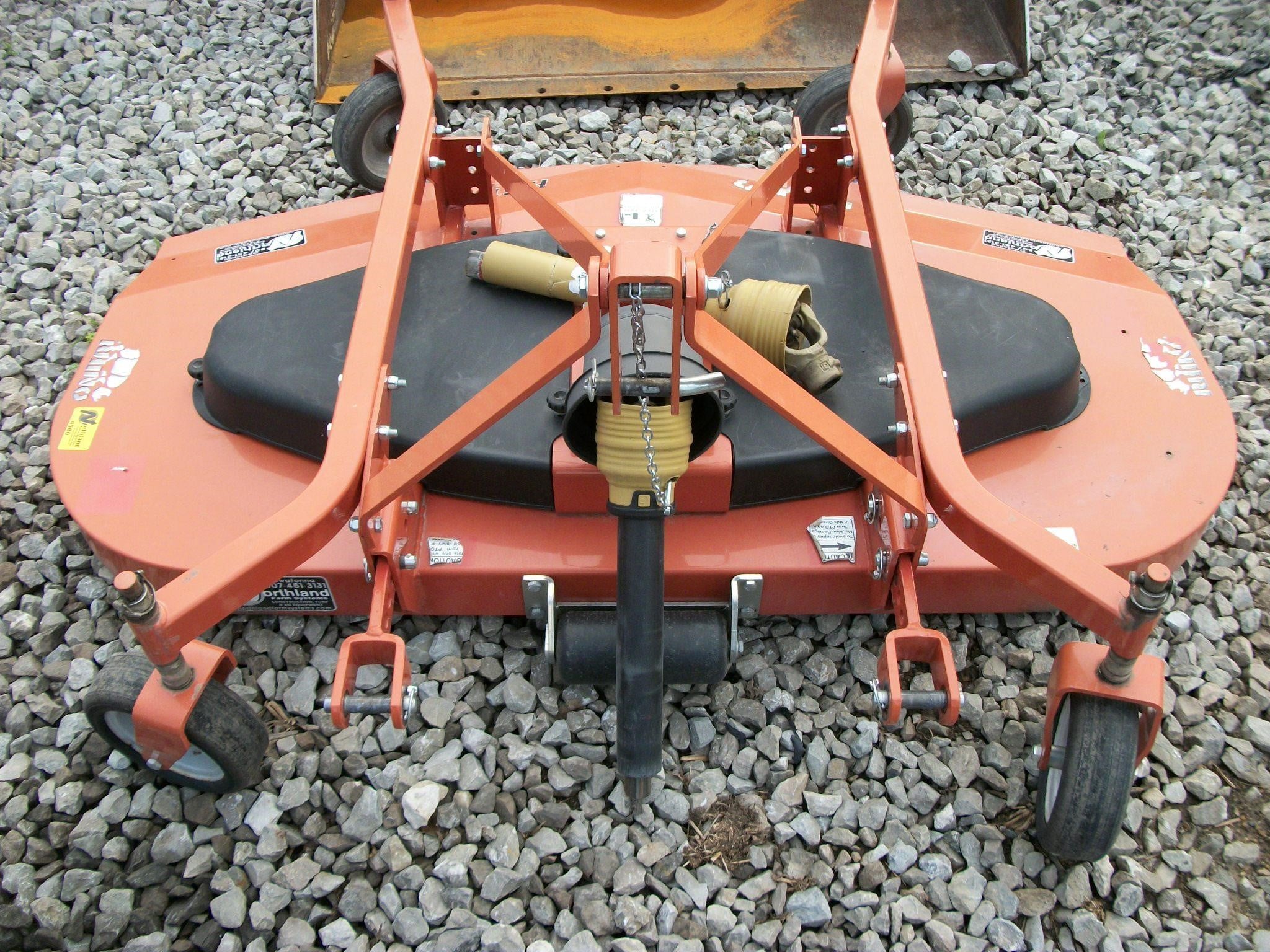 A 2022 Rhino FA613 slasher sits on a gravel lot.