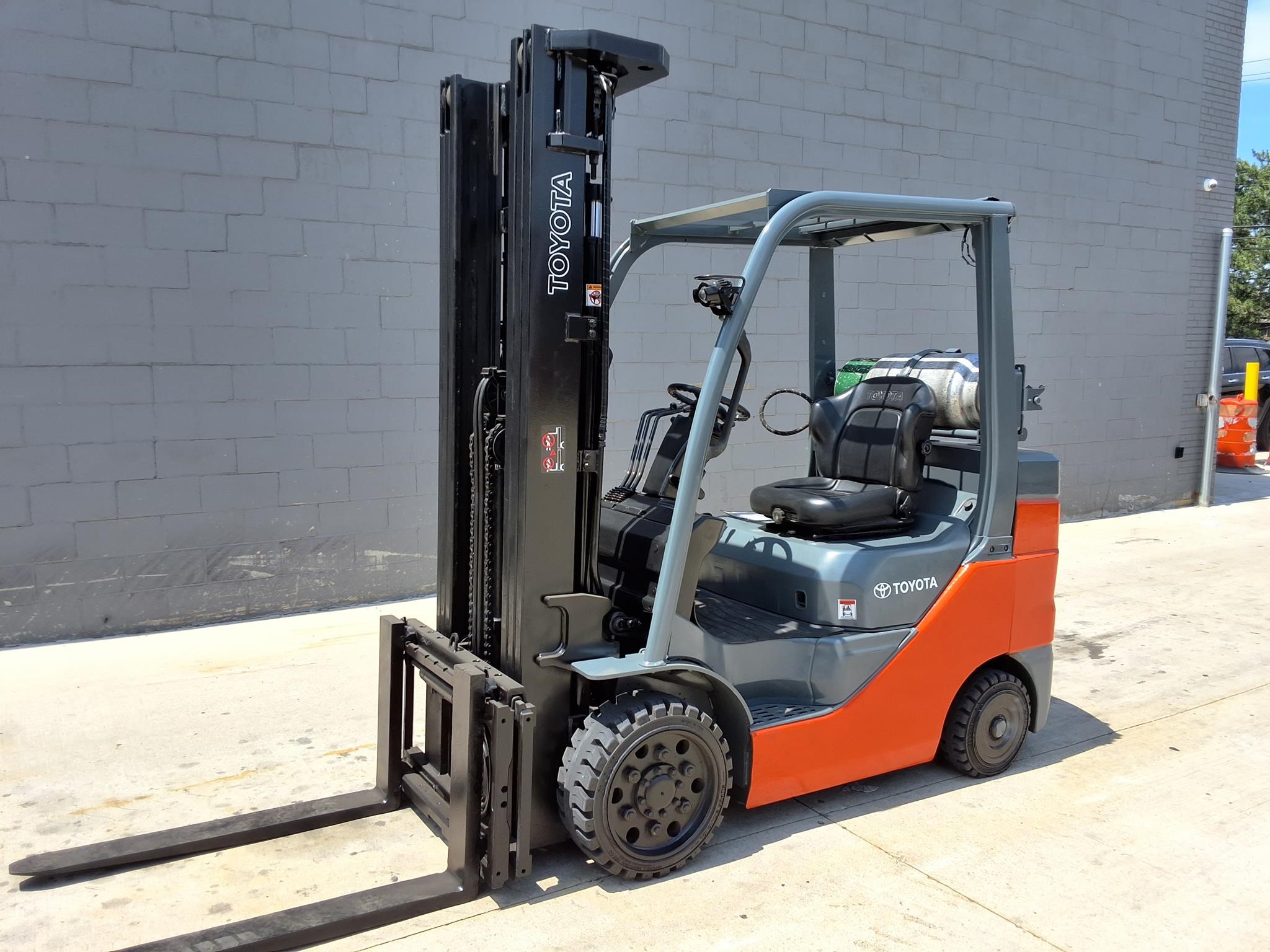 A 2021 Toyota 8FGCU30 cushion-tire forklift parked outdoors.