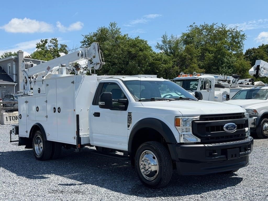 A 2022 IMT 7500-22 mounted boom truck crane sits on a lot.
