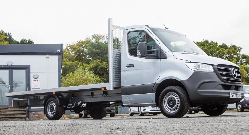 A 2025 Mercedes-Benz Sprinter 315 standard flatbed van parked outdoors.
