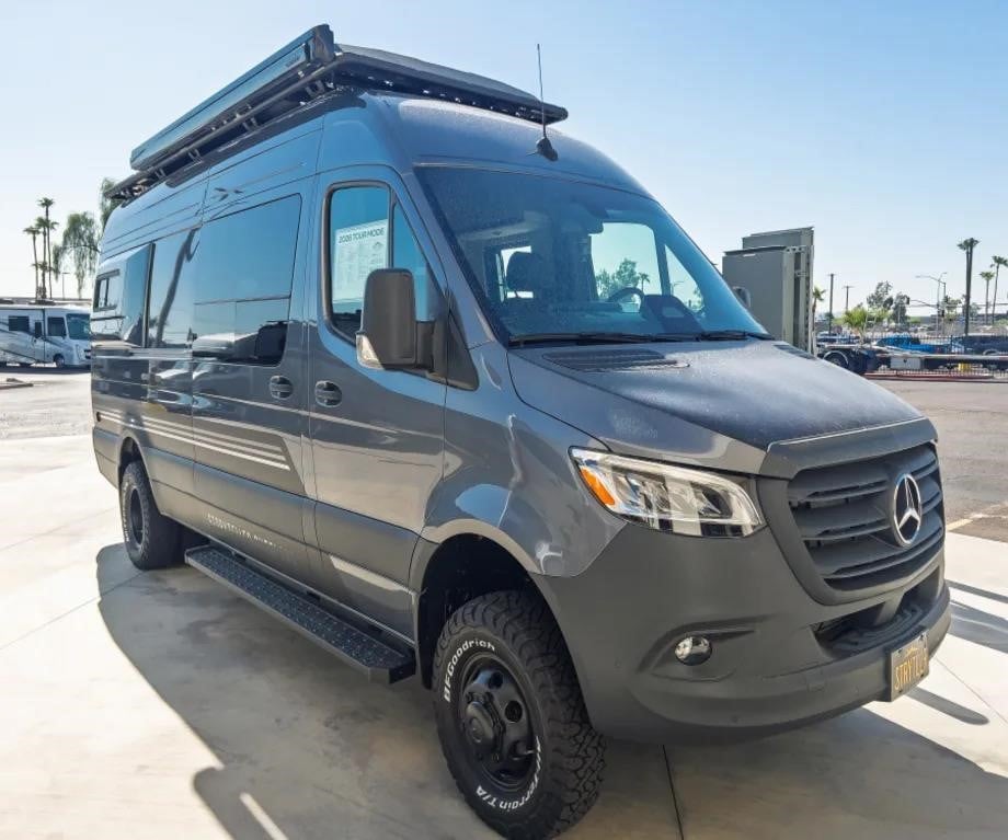 A 2026 Storyteller Overland Tour Mode XL Class B motorhome sits on a lot.