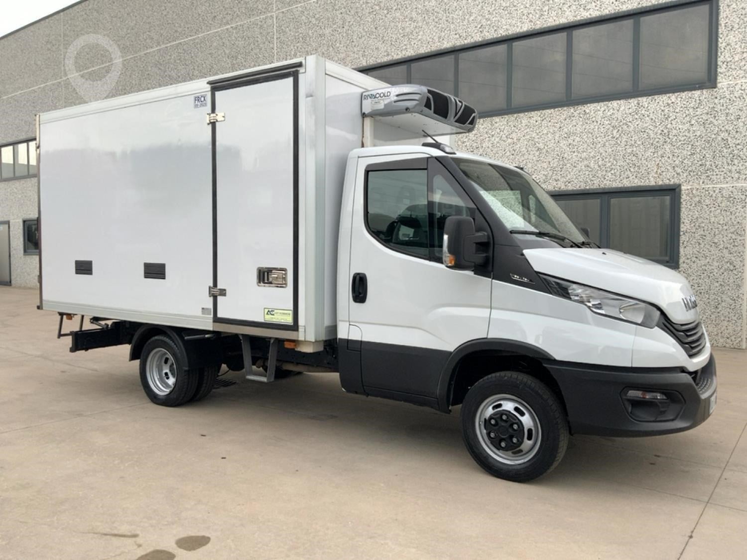 A 2023 Iveco Daily 35C16 box refrigerated van sits on a lot.