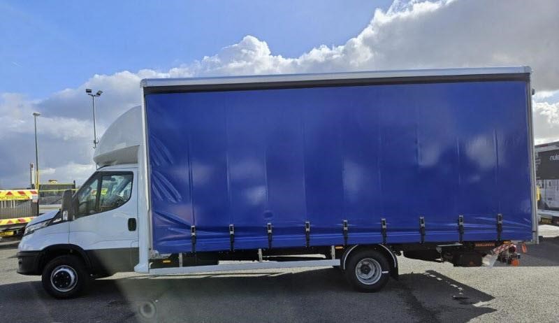 A 2026 Iveco Daily 20L9 curtainside van parked outdoors.