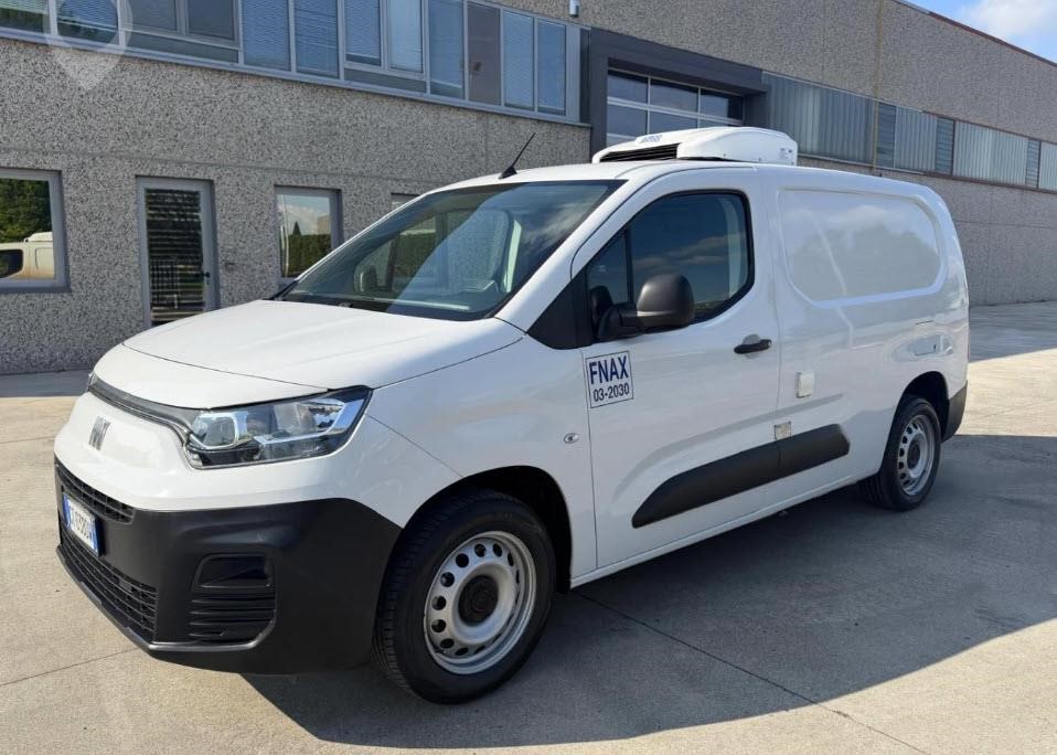 A 2024 Fiat Doblo panel refrigerated van parked outdoors.
