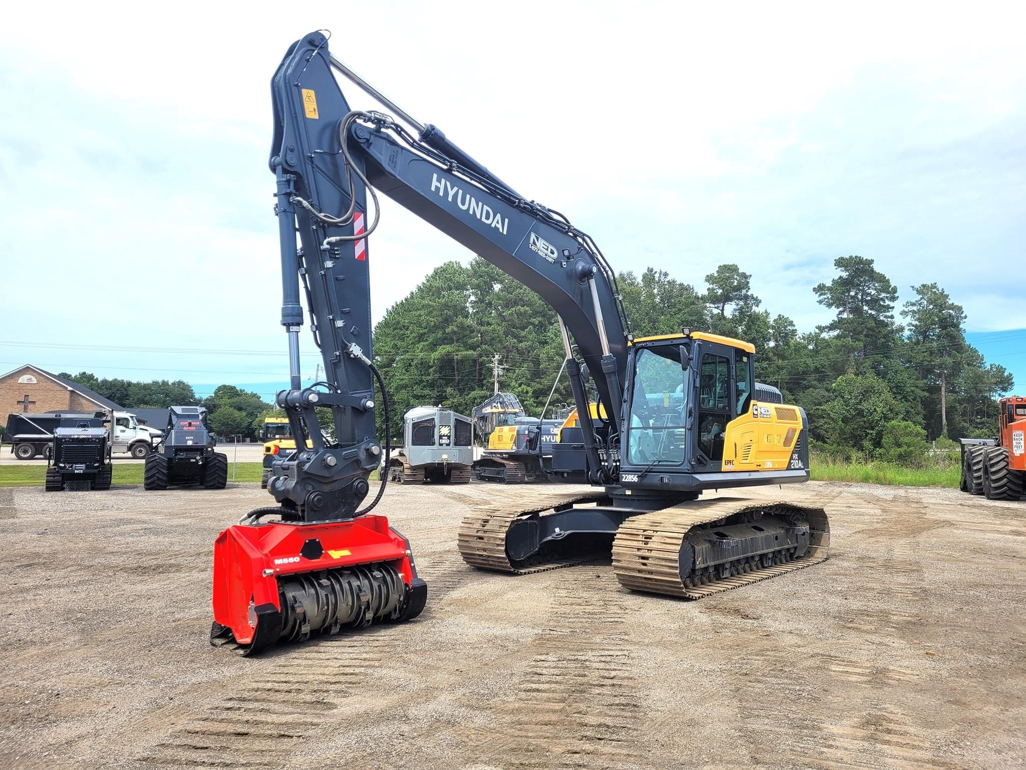 2026 Hyundai HX210AL Excavator Mulcher parked outdoors.