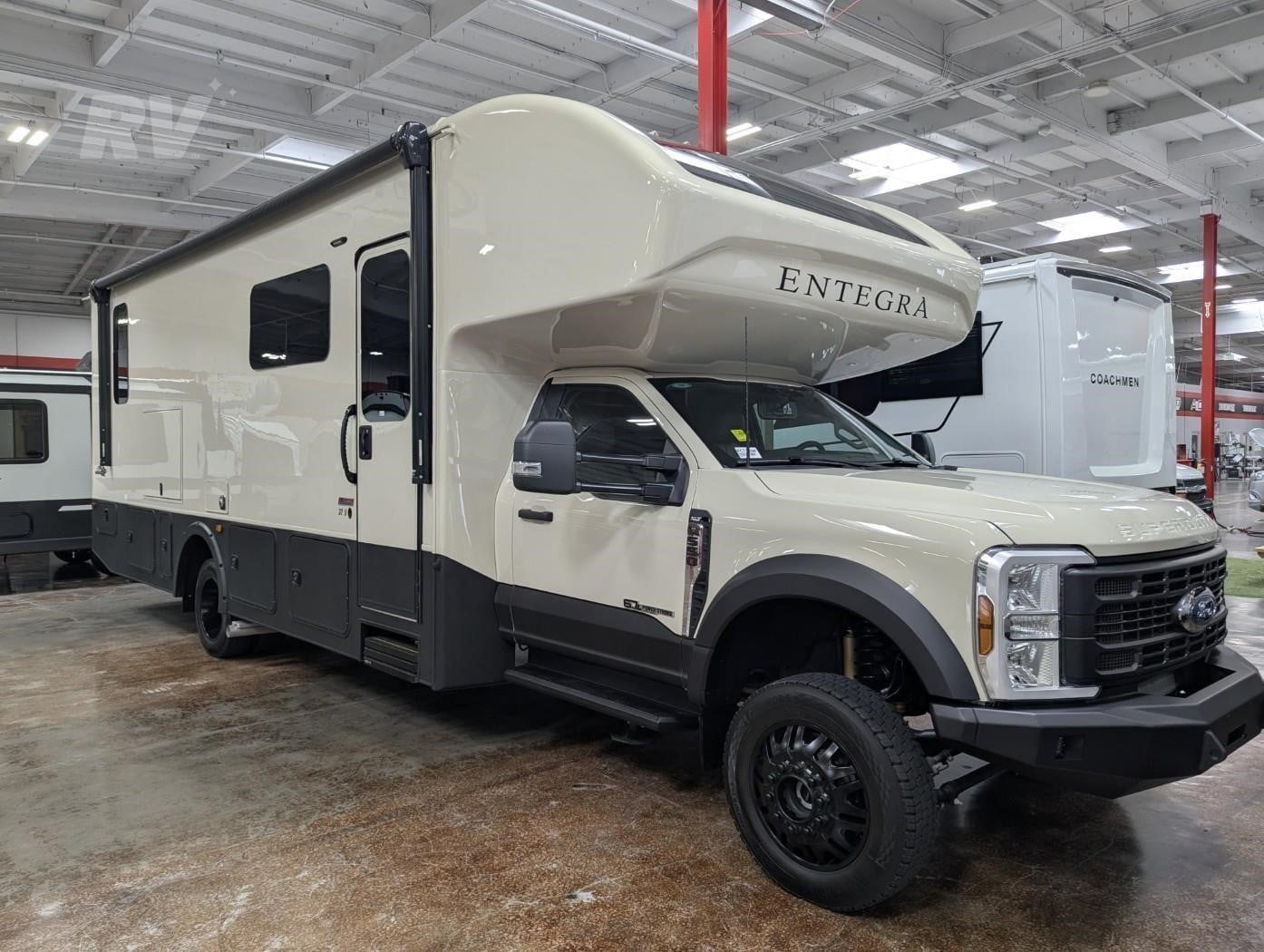 A 2026 Entegra Coach Esteem XL 32U Class C diesel motorhome parked indoors.