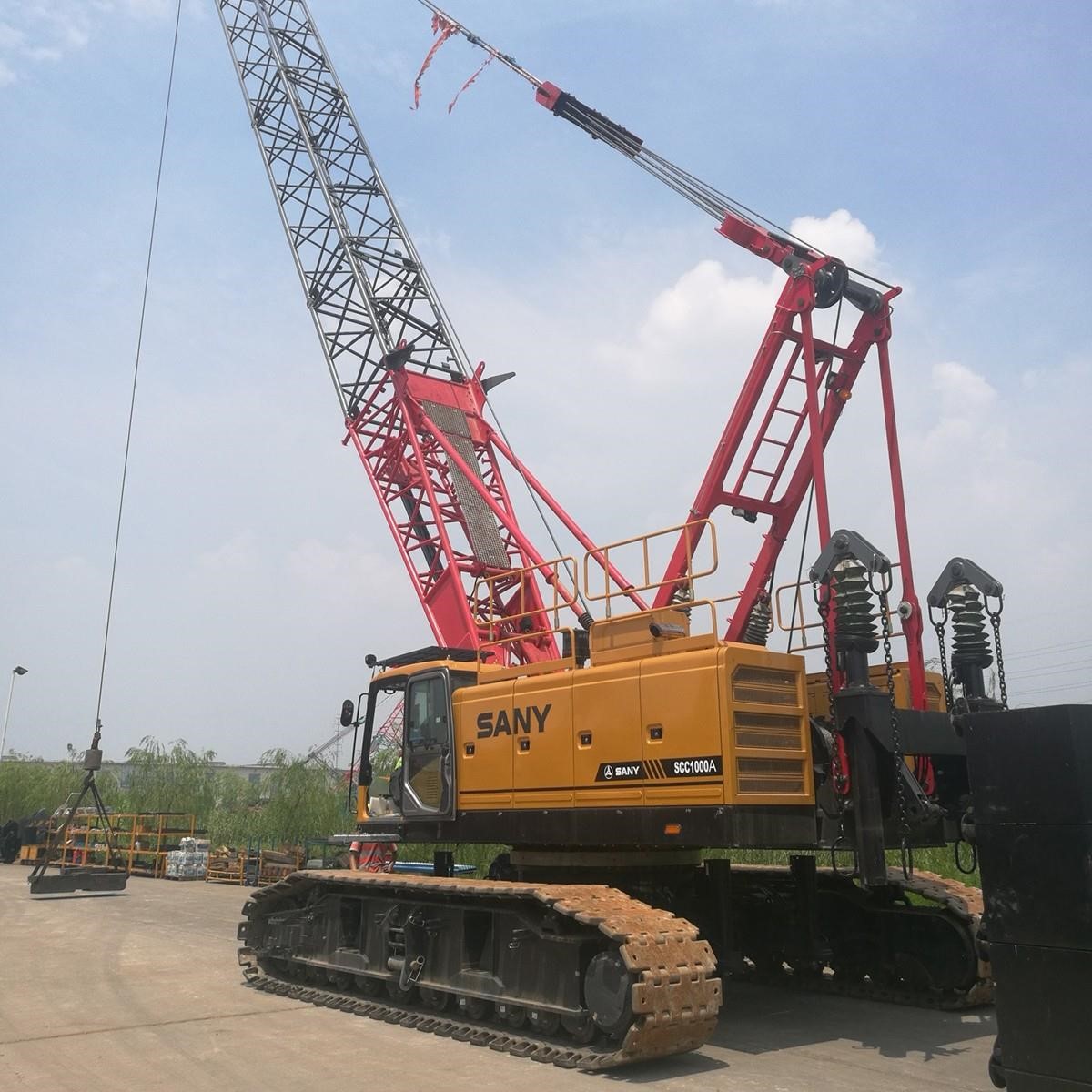 A 2026 Sany SCA1000A lattice boom crawler crane on a jobsite.