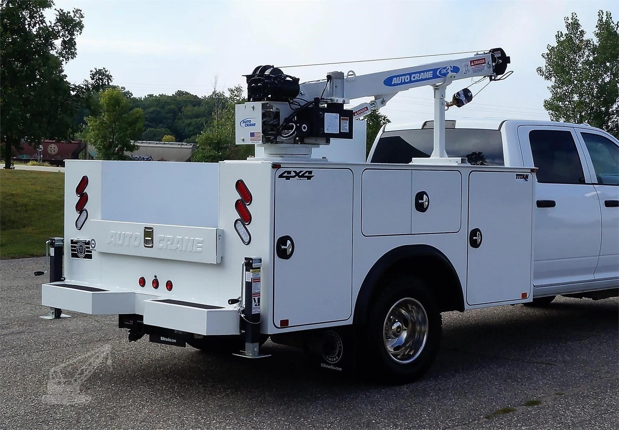 A 2026 Auto Crane EHC-3² Un-Mounted Boom Truck Crane on a work truck.