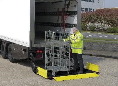 Notice the safety feature of roll stops on this trailer tail lift Taiil lift