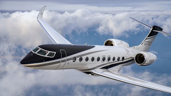 A 19-passenger Gulfstream Aerospace G700 business jet flies above the clouds.