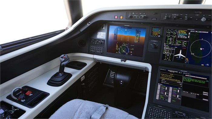 Flight simulator for Embraer Praetor business jets showing Rockwell Collins Pro Line Fusion flight deck and pilot’s seat.
