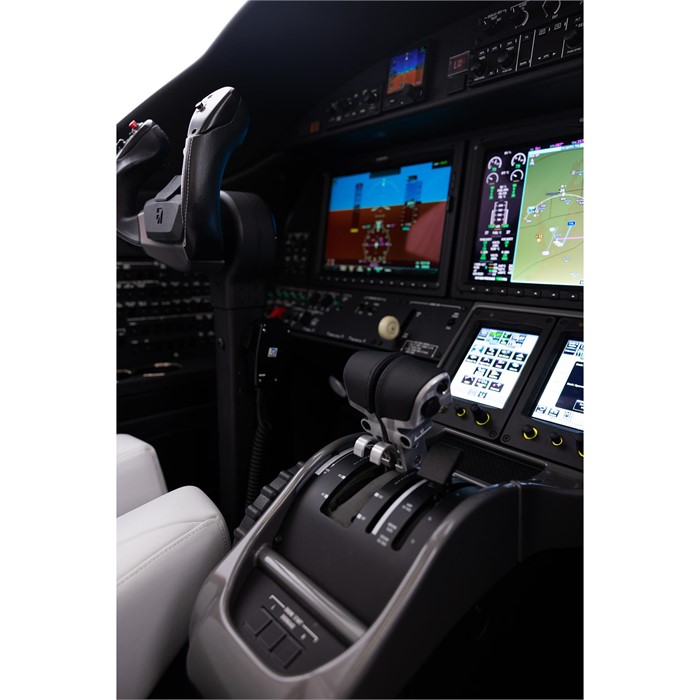 The cockpit of a Cessna Citation CJ3 Gen2 light business jet equipped with touchscreen displays, throttle, and other avionics components.