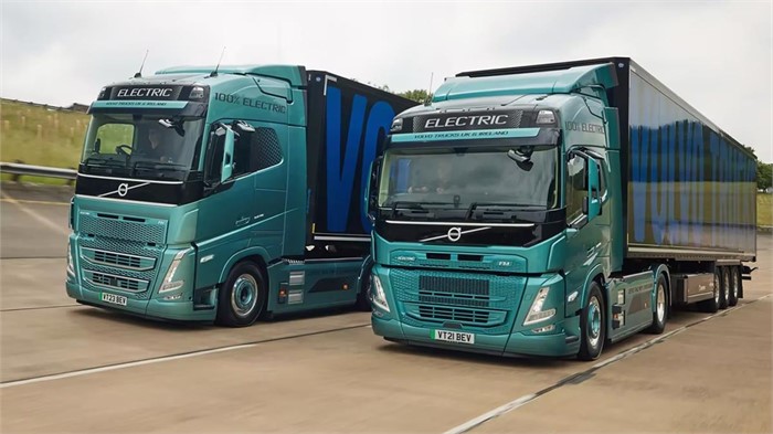 Volvo FH Electric and Volvo FM Electric tractor units on the road.