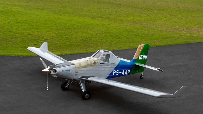 A piston-single Embraer EMB-203 Ipanema agricultural airplane sits on a paved runway. 