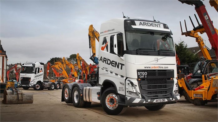 Two of Ardent Hire’s brand-new Volvo FH 500 tractor units parked among some of the firm’s many plant machines.
