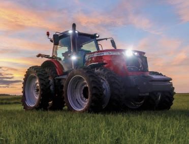 a large red tractor in a field
