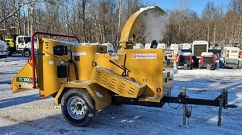 A 2024 Vermeer BC1000XL towable wood chipper.